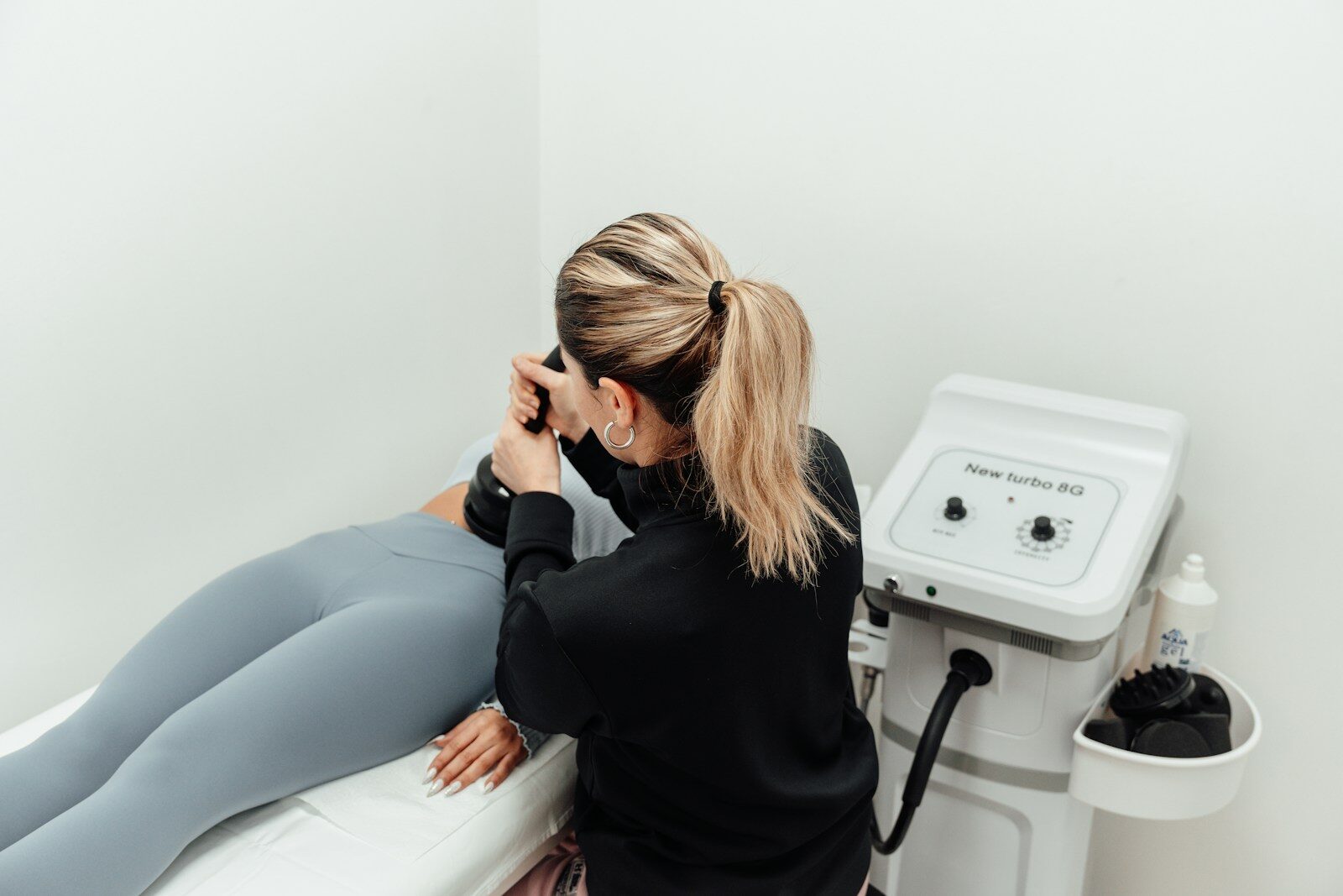 a woman getting her leg examined by a doctor